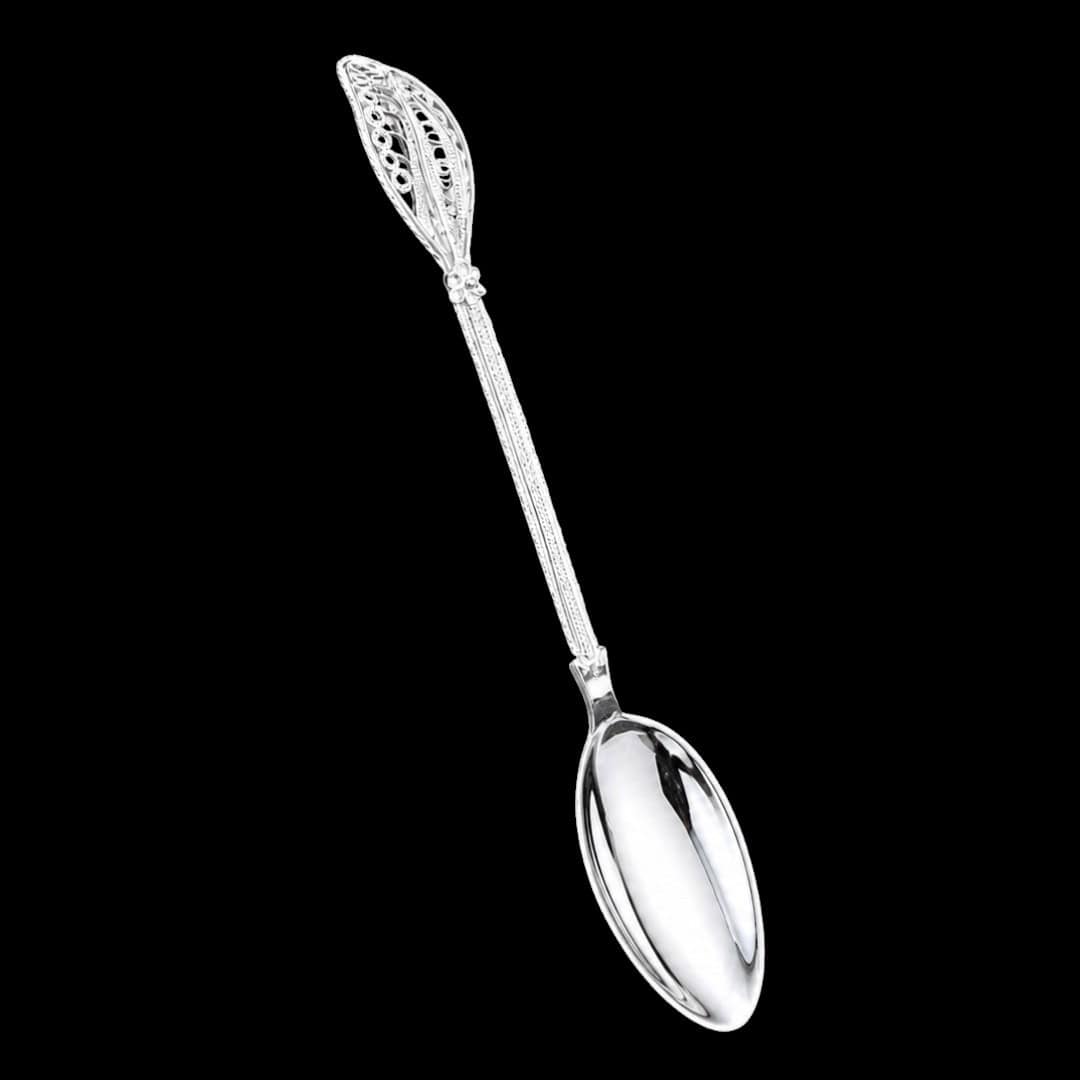 Handmade silver filigree spoon with a twisted stem and teardrop openwork handle, by Lefkara Silver Cyprus.