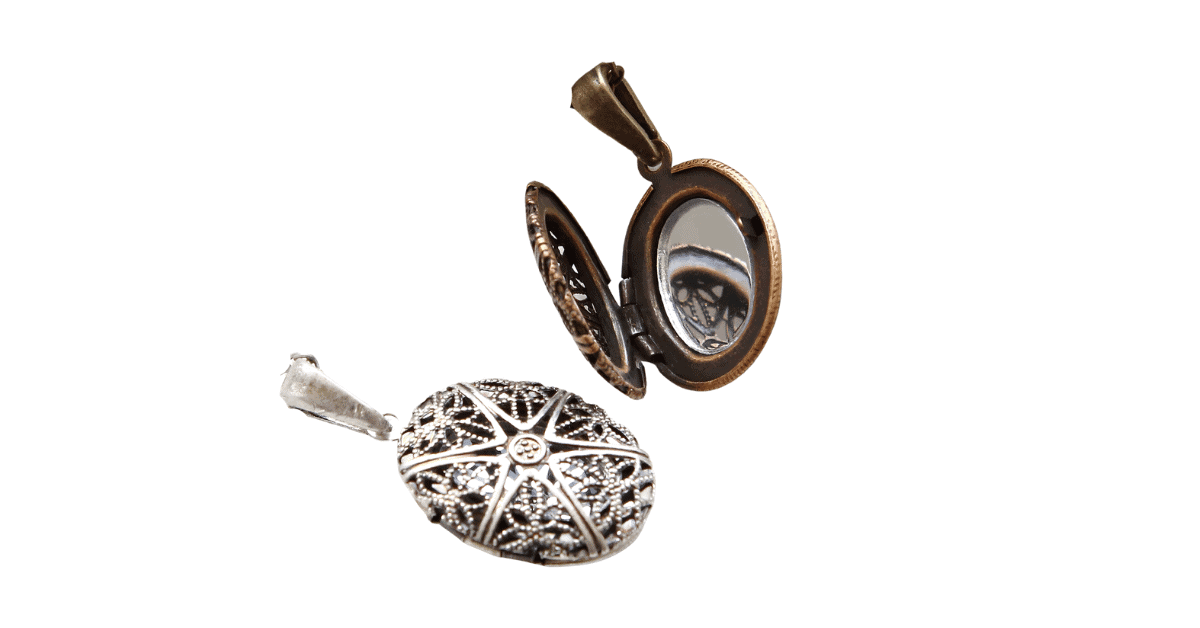 Two vintage filigree lockets with a mirror inside.