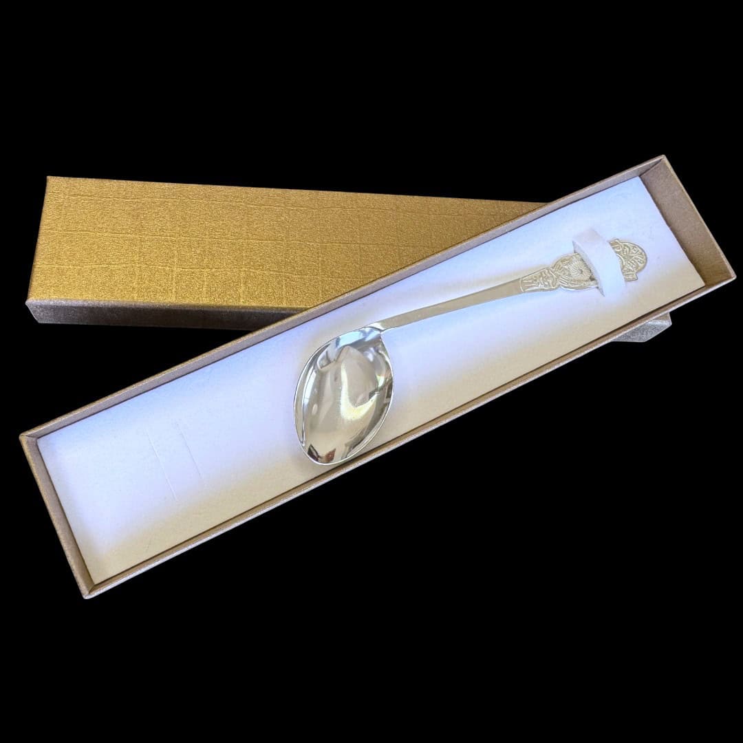 Handmade silver baby feeding spoon with an engraved pierced medallion handle, by Lefkara Silver Cyprus.