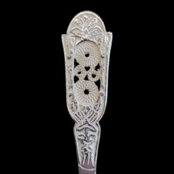 Handmade silver baby feeding spoon with an engraved pierced medallion handle, by Lefkara Silver Cyprus.