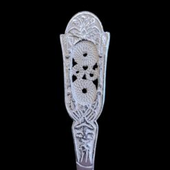 Handmade silver baby feeding spoon with an engraved pierced medallion handle, by Lefkara Silver Cyprus.
