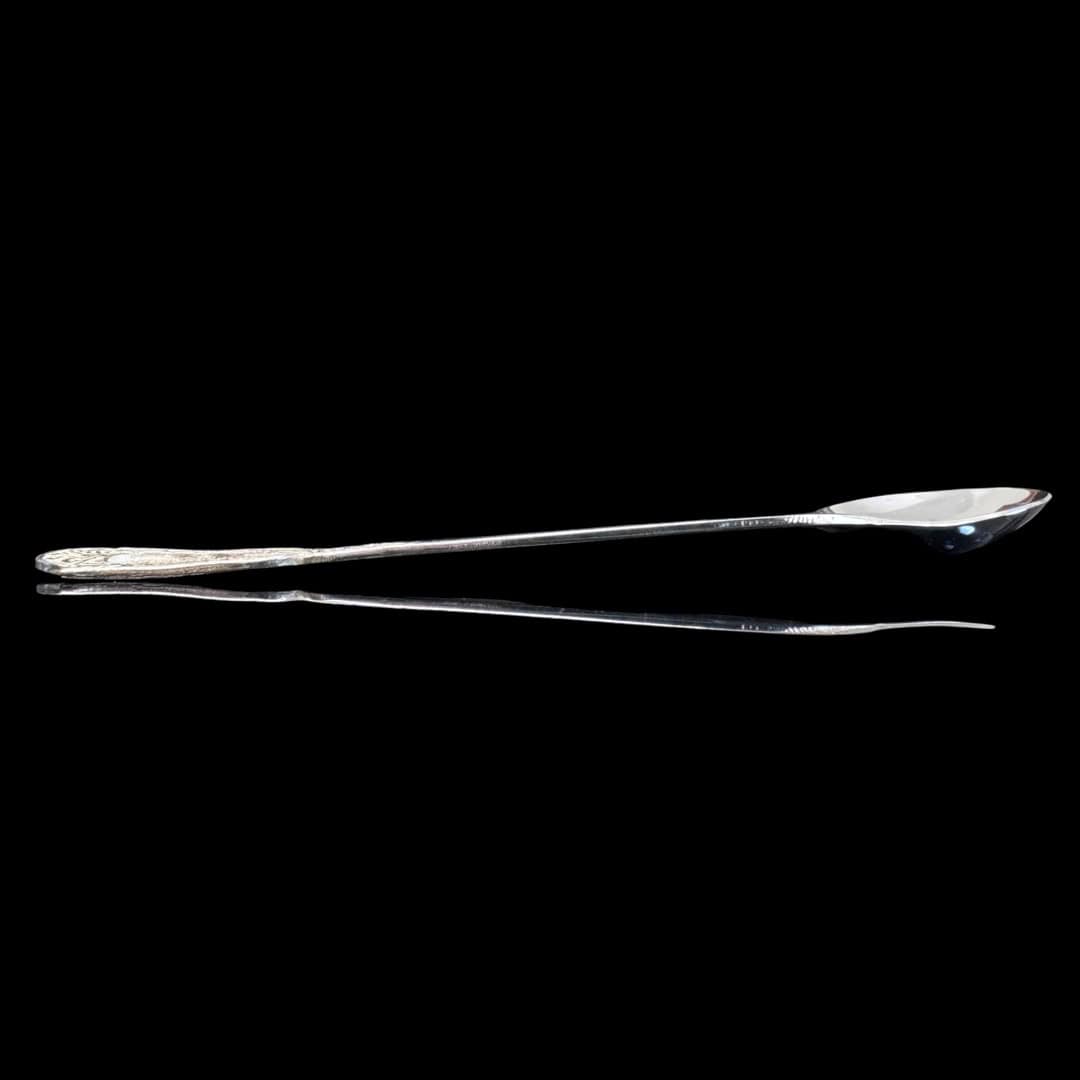 Handmade silver baby feeding spoon with an engraved pierced medallion handle, by Lefkara Silver Cyprus.