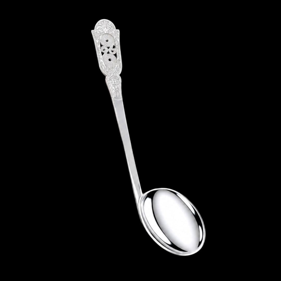 Handmade silver baby feeding spoon with an engraved pierced medallion handle, by Lefkara Silver Cyprus.