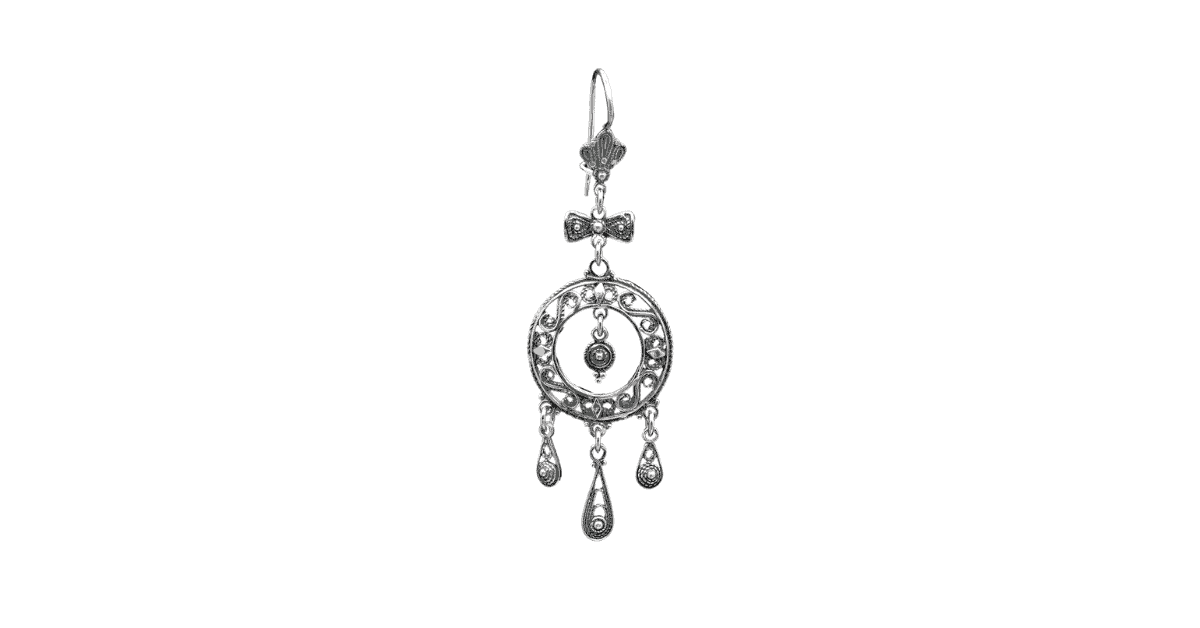 A silver filigree earring. 